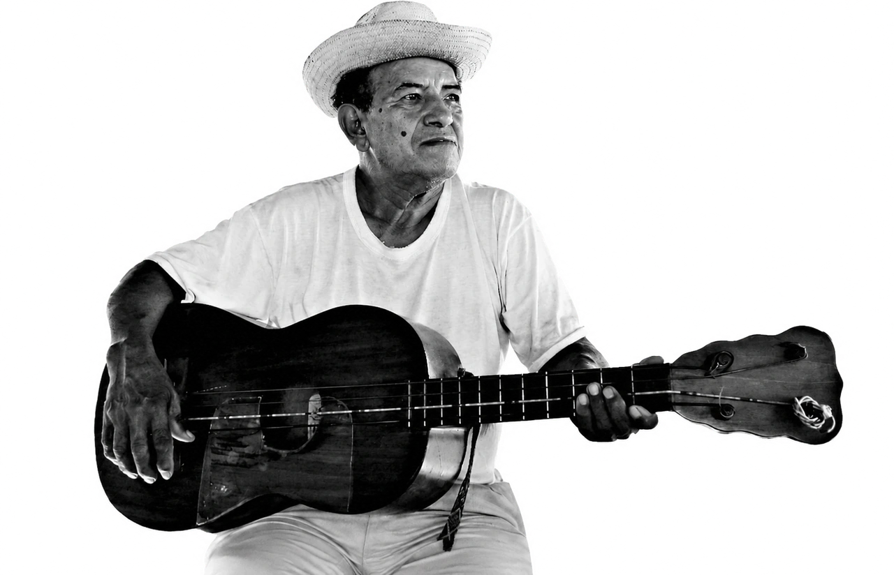 A musician in a straw hat holding a guitar, from the La Bamba program archive