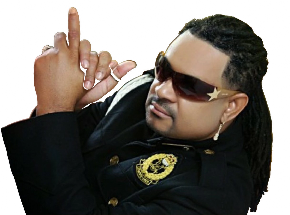 Luis Vargas in sunglasses and a black jacket, with his hands raised; photograph supplied by Afropop Worldwide